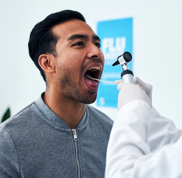 Dental professional performing an oral cancer screening