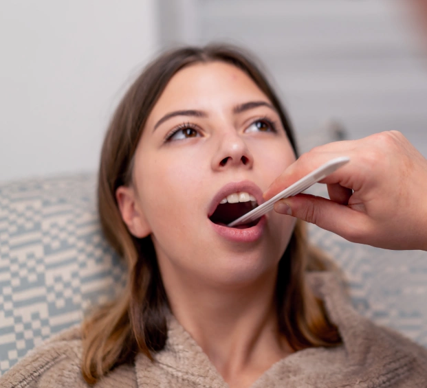 Patient receiving an oral examination from a dental professional