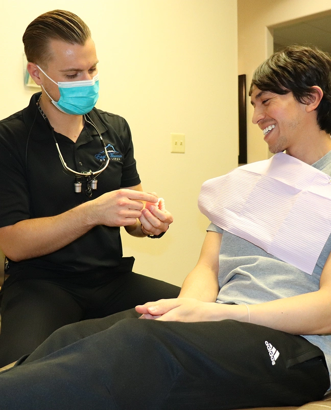 Dentist examines a patient’s mouth and provides dental care during an appointment.