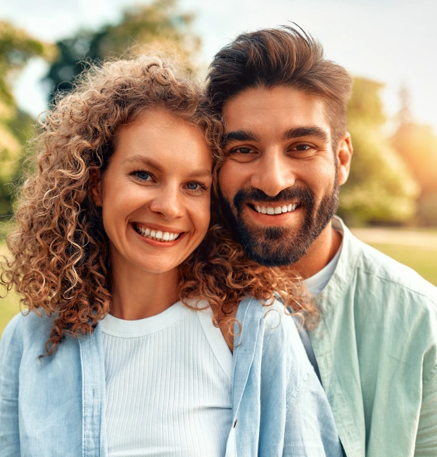 Smiling couple representing preventive dental care