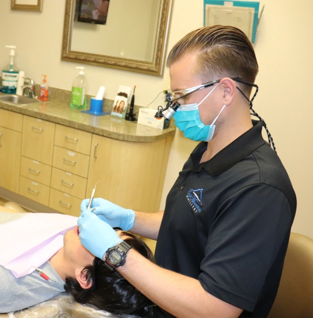 Dentist providing restorative dental treatment to a patient