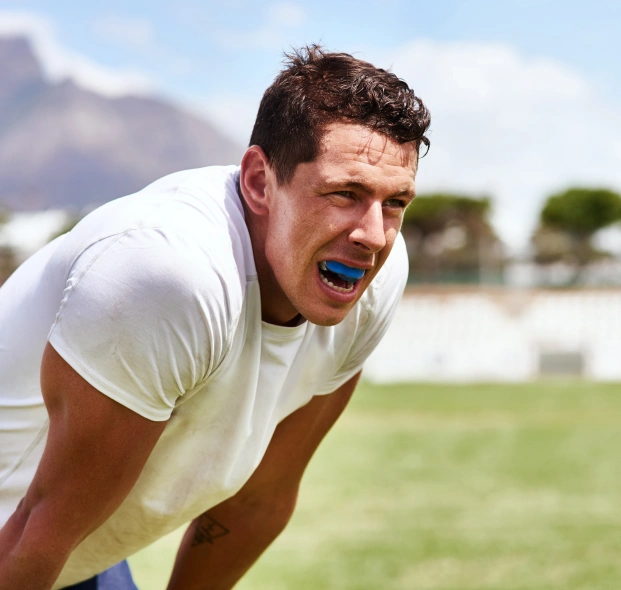 Man wearing a sports mouthguard during athletic activity